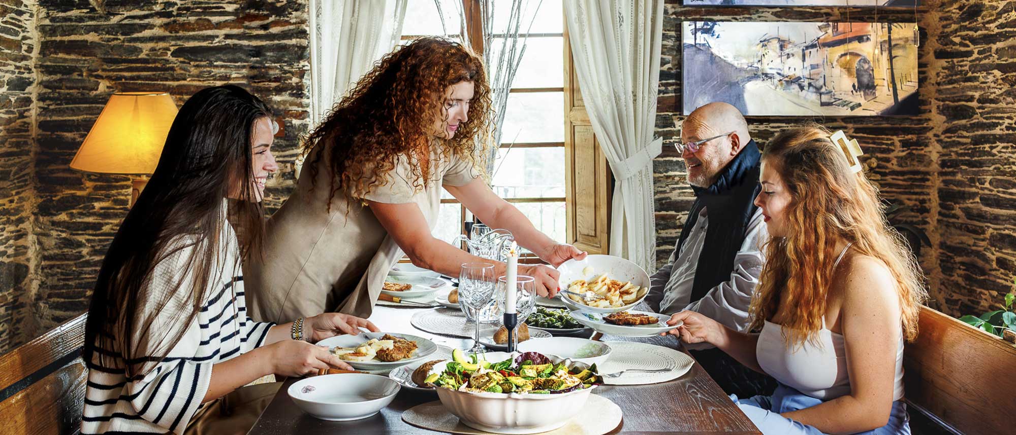 Photograph of the Country Homes Group family eating in the dining room of their home.